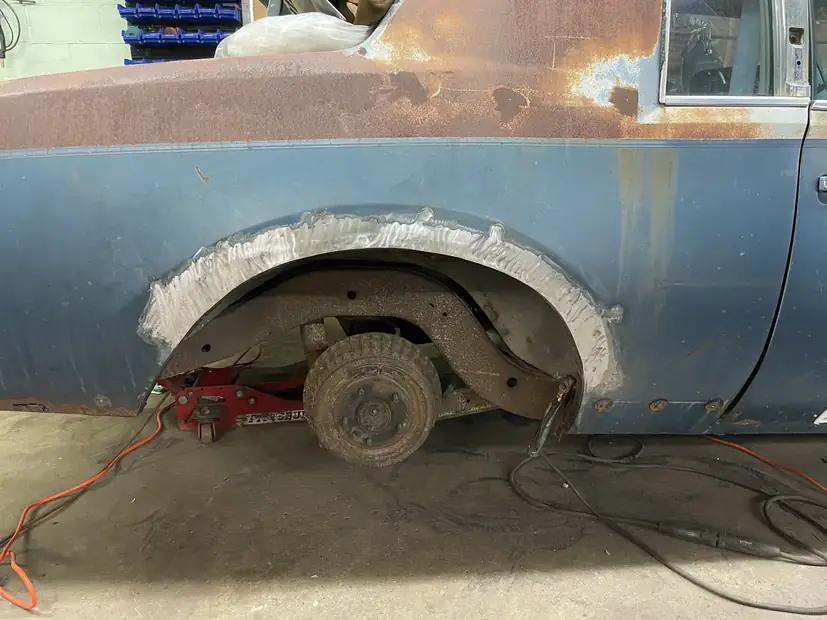 Rusted wheel arch cut back and new steel welded in, for a Maple Heights customer