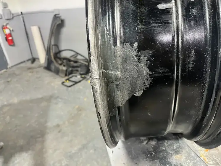 Alloy wheel with a repaired section on the inner barrel