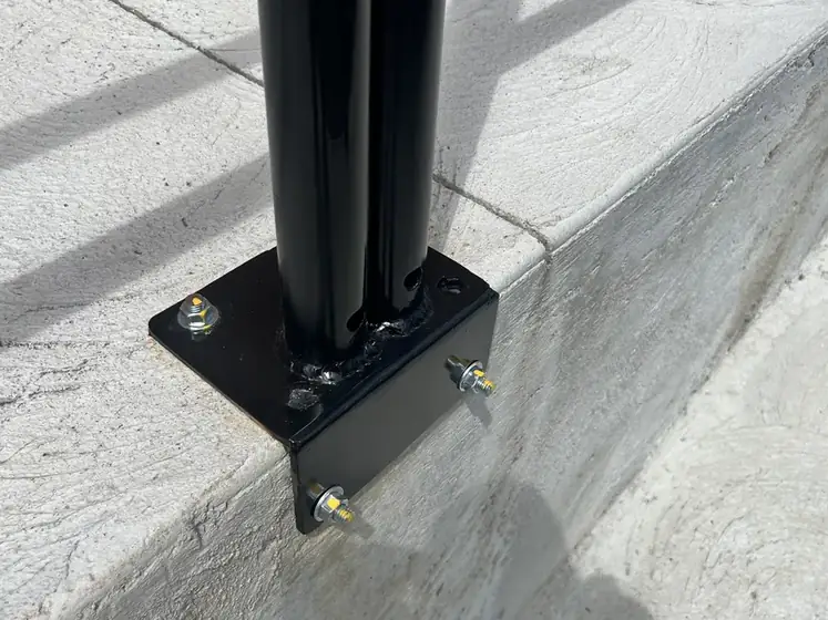 Fabricated steel post set and finished