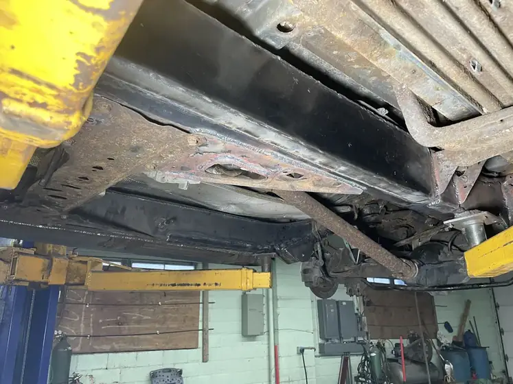 Repaired frame member coated after welding