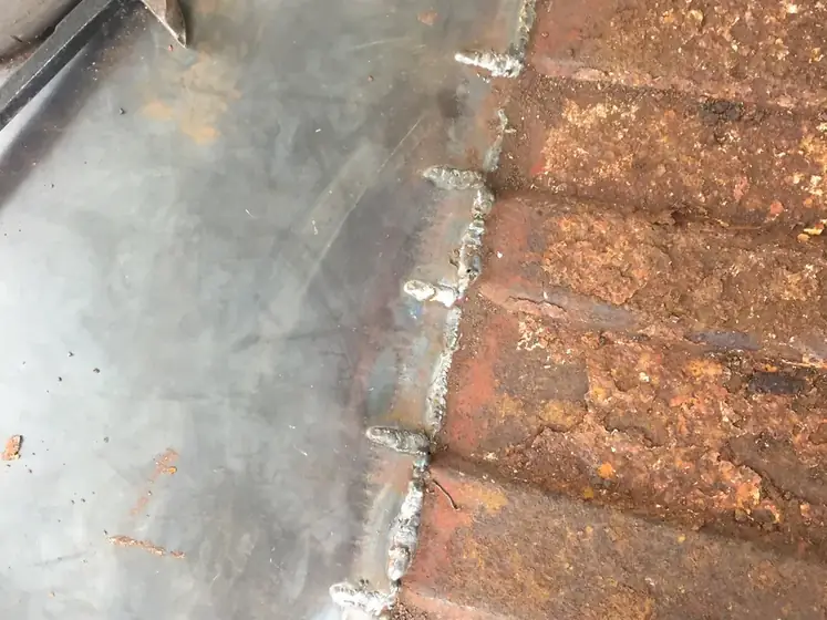 Rusted floor section before it is cut out