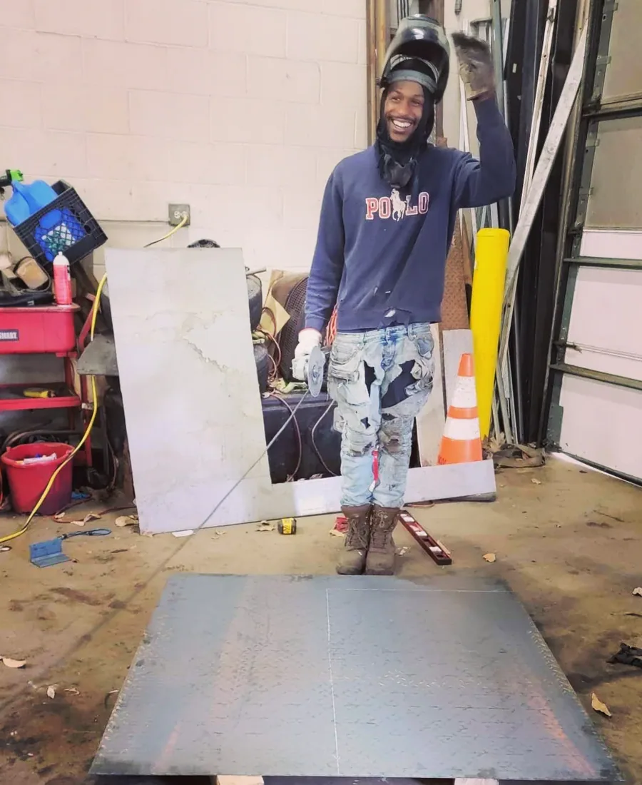 Rashaad, owner of Arc Wheels Welding, in the Cleveland shop
