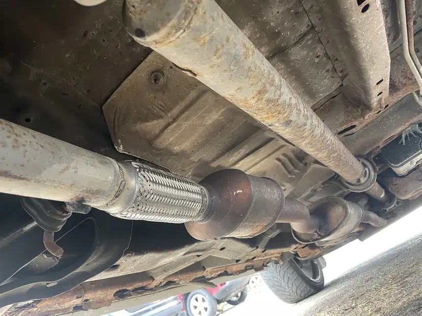Catalytic converter in place under a vehicle