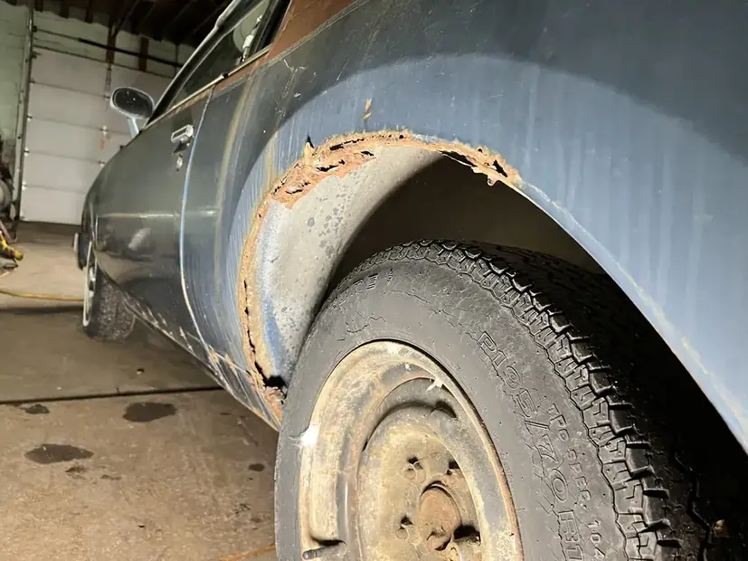 Wheel arch cut back on a vintage vehicle