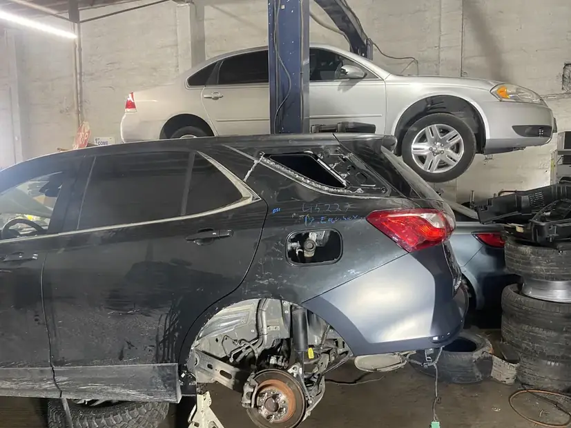 Collision damage to a front quarter before repair