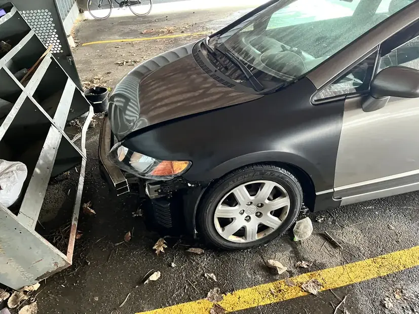 Front corner damage on a car brought in after a collision