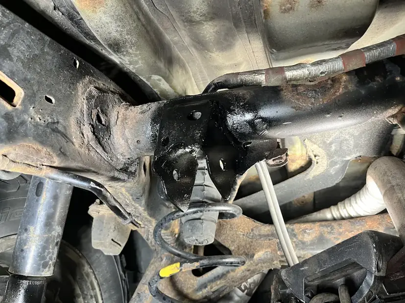 Custom mount fabricated and fitted under a vehicle