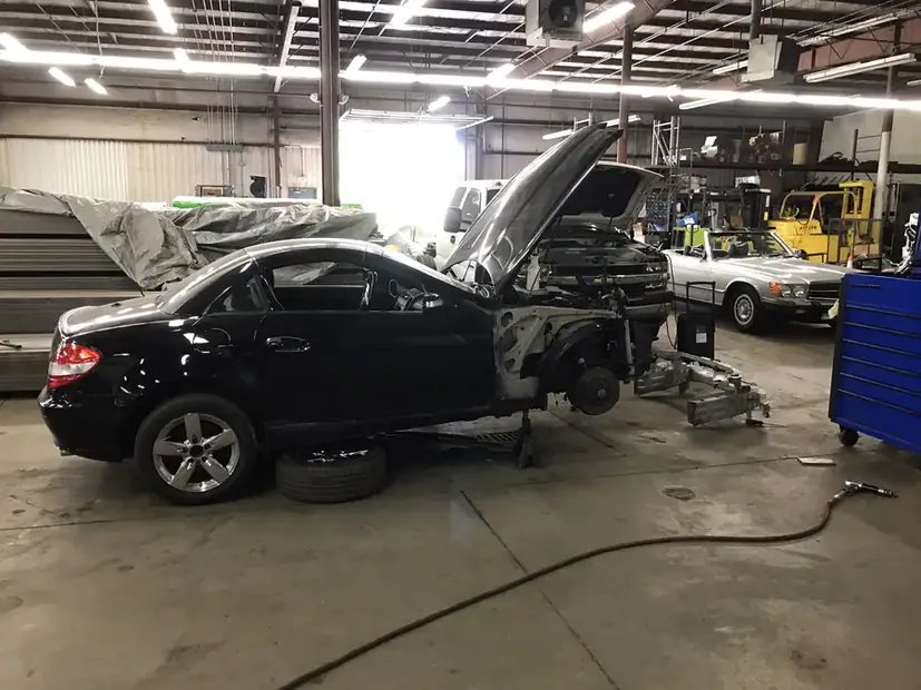 Rear quarter panel damage on a car in the shop