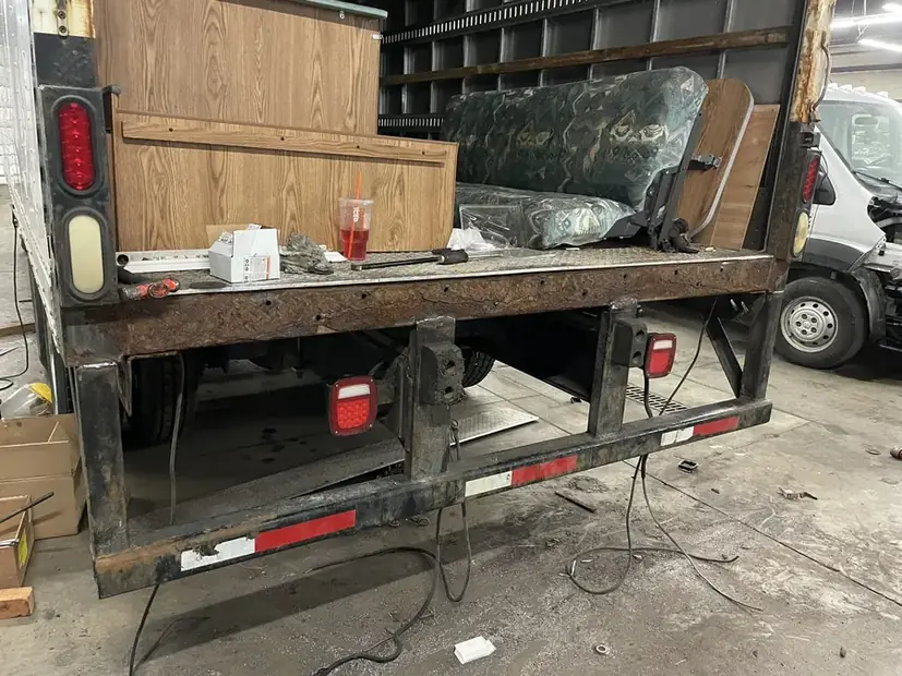 Rear end of a flatbed trailer where the guard mounts