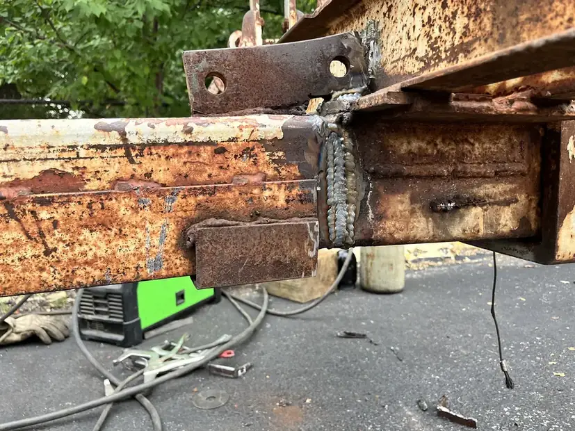 Rusted trailer frame member before repair