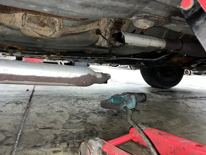 Exhaust system under a vehicle during repair