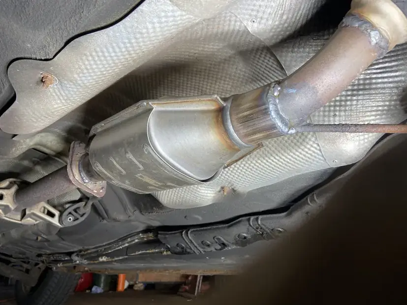 Flex pipe and catalytic converter section under a vehicle