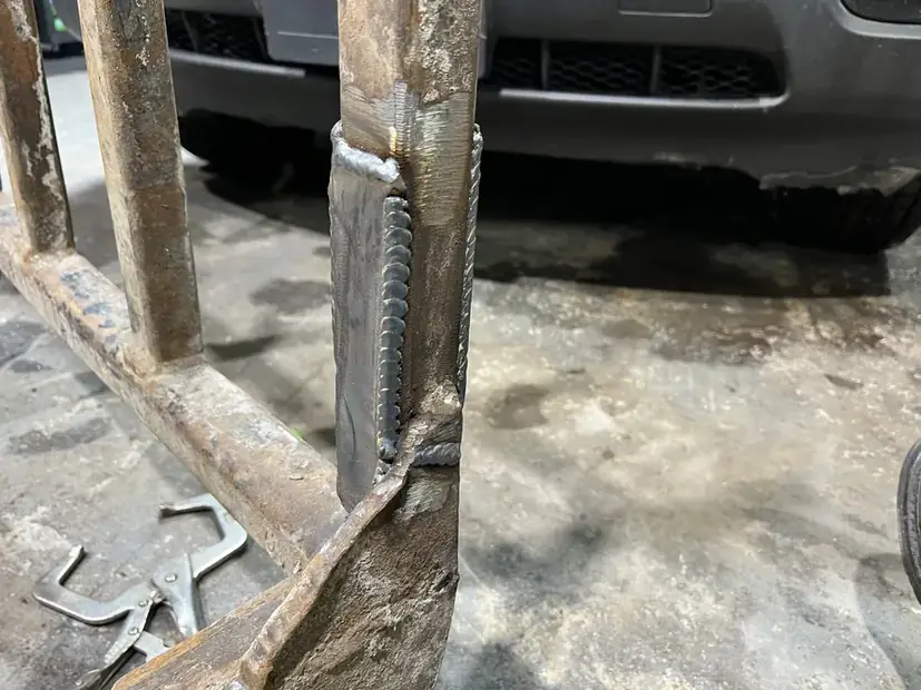 Repaired weld on a steel frame
