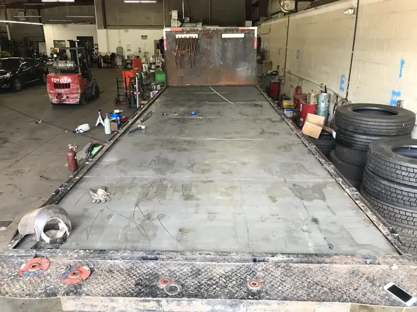 Trailer ramp lowered in the shop