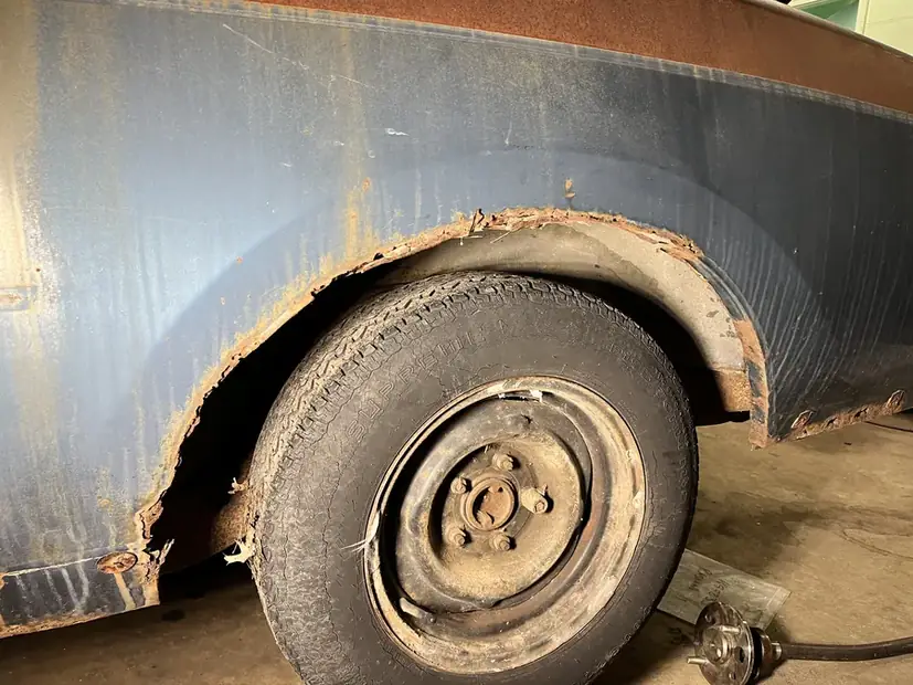 Rusted wheel arch on a vehicle brought in for patch repair