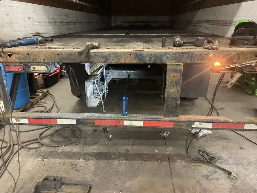 Trailer frame section on stands during welding