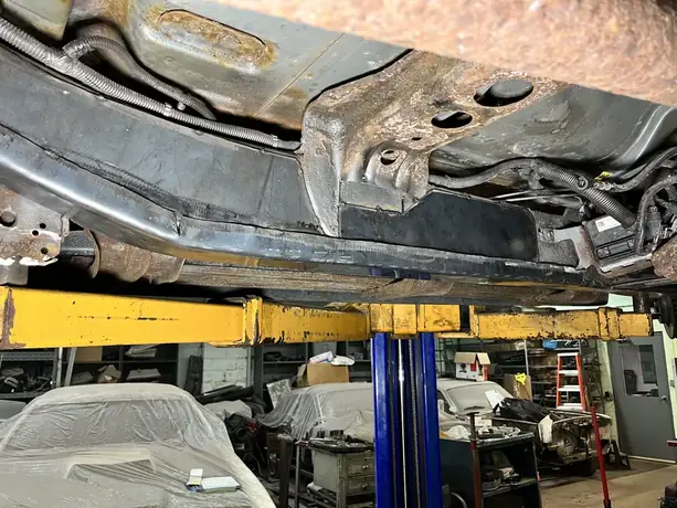 Truck frame repair underway on the lift